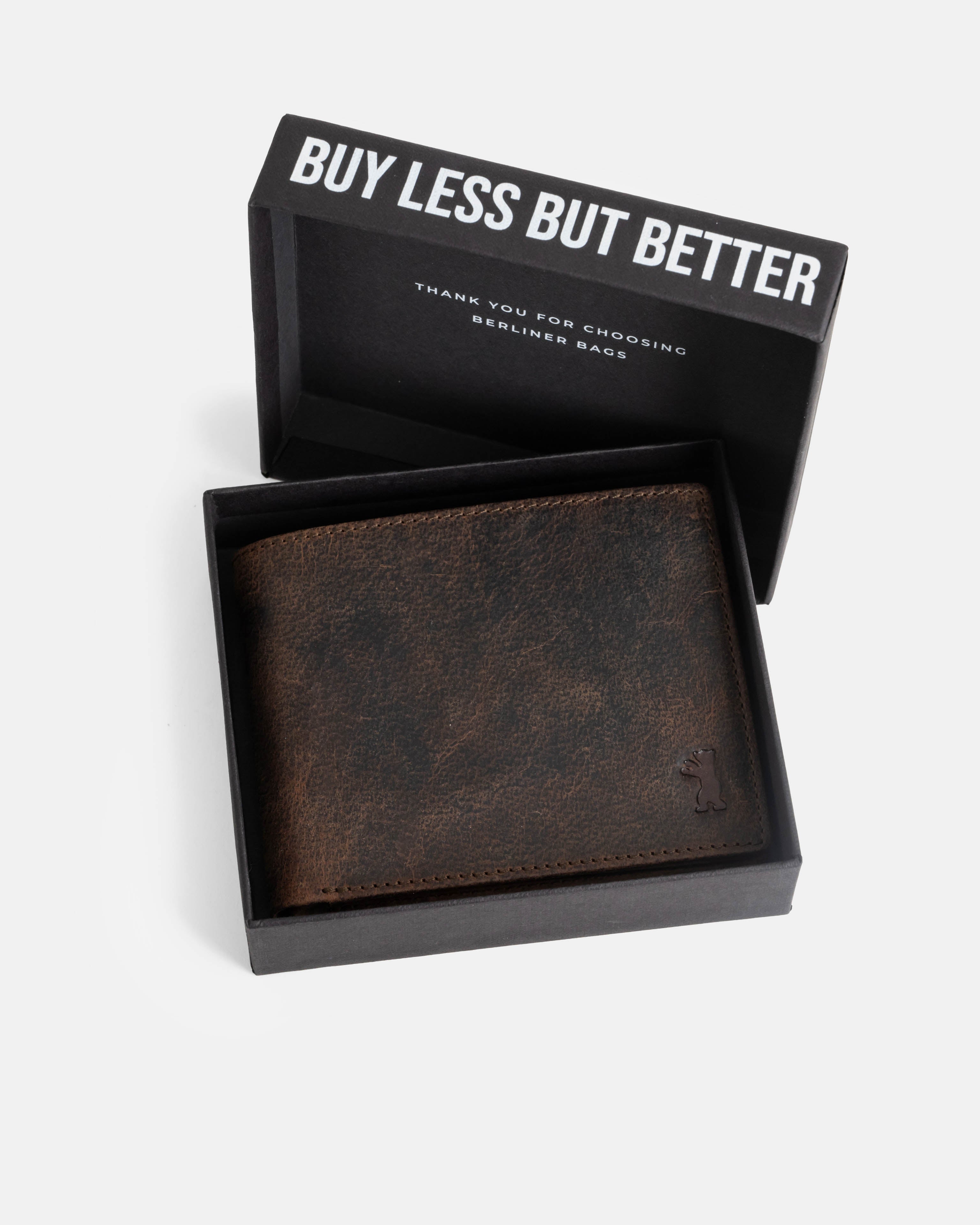 A earth leather wallet with ID flap inside the branded box