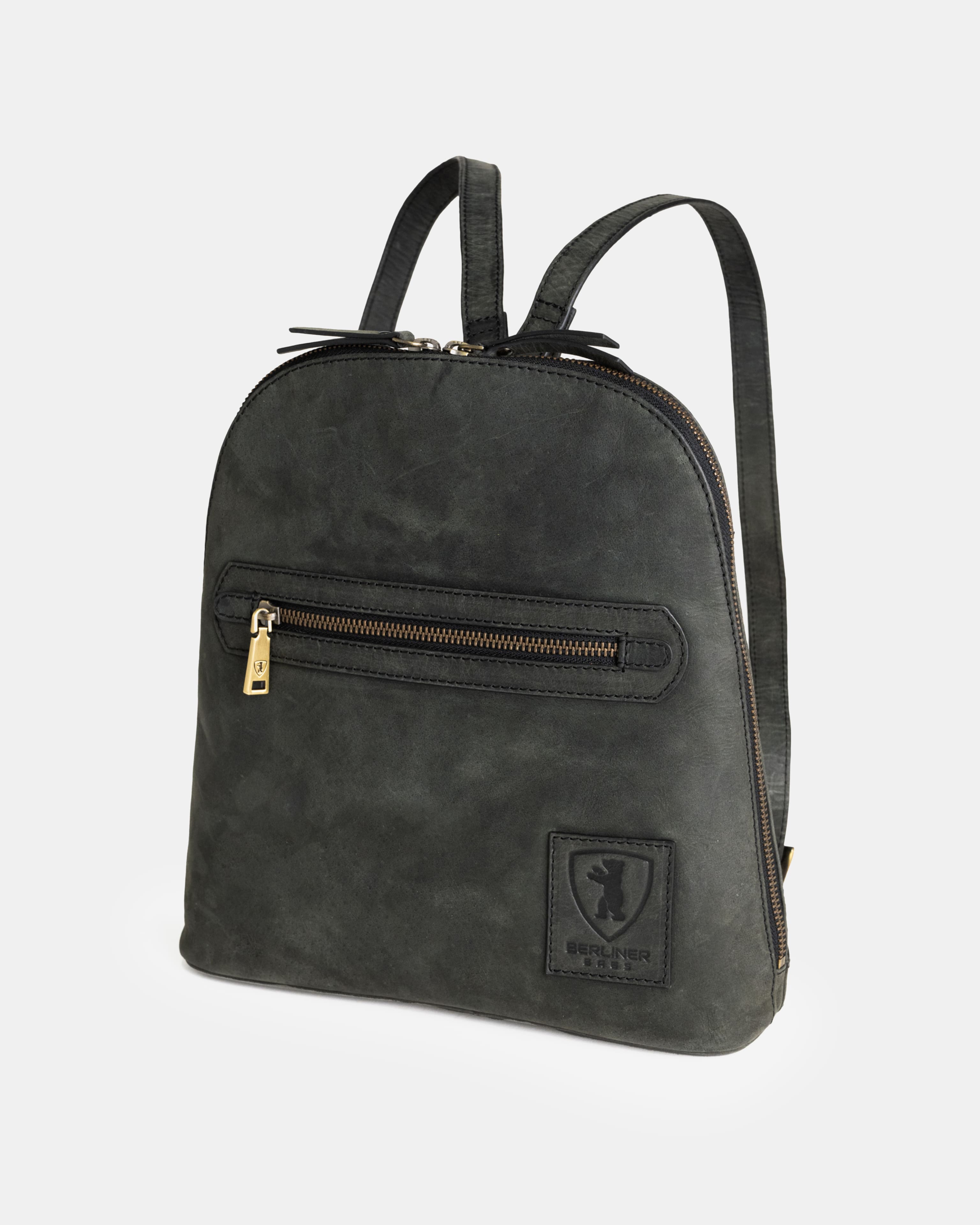 Three-quarter view of dark grey leather zip-around backpack