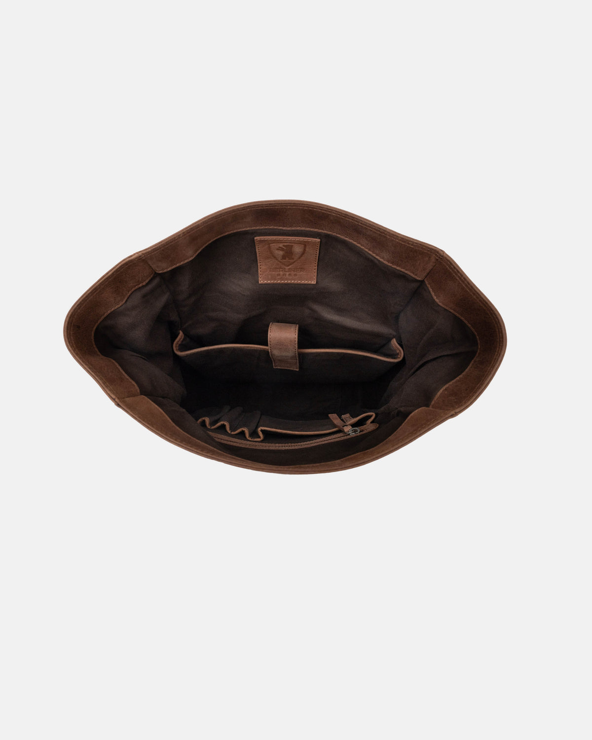 Top-down showing open empty camel interior compartment of a camel backpack