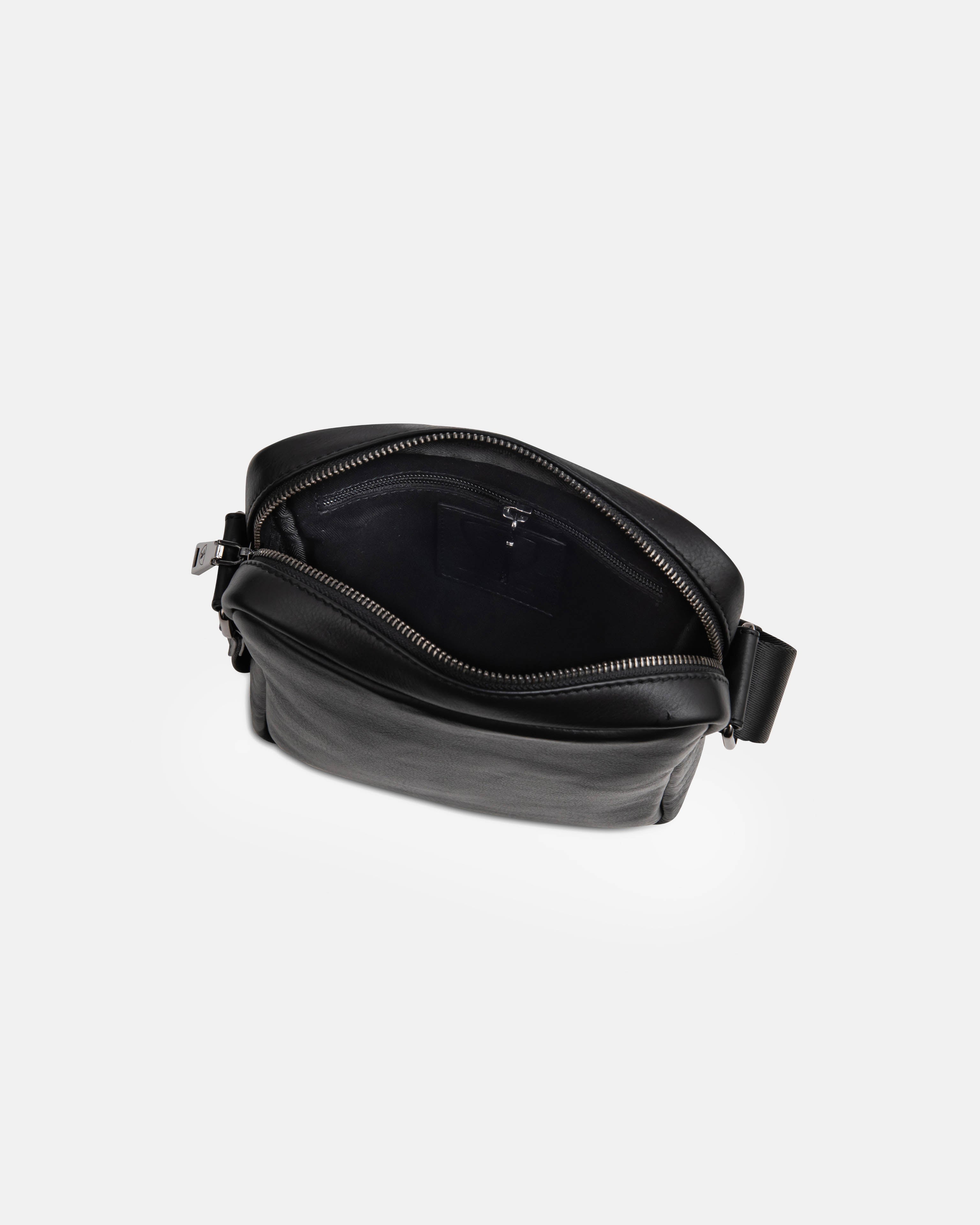 Top-down open view of black leather messenger bag interior details