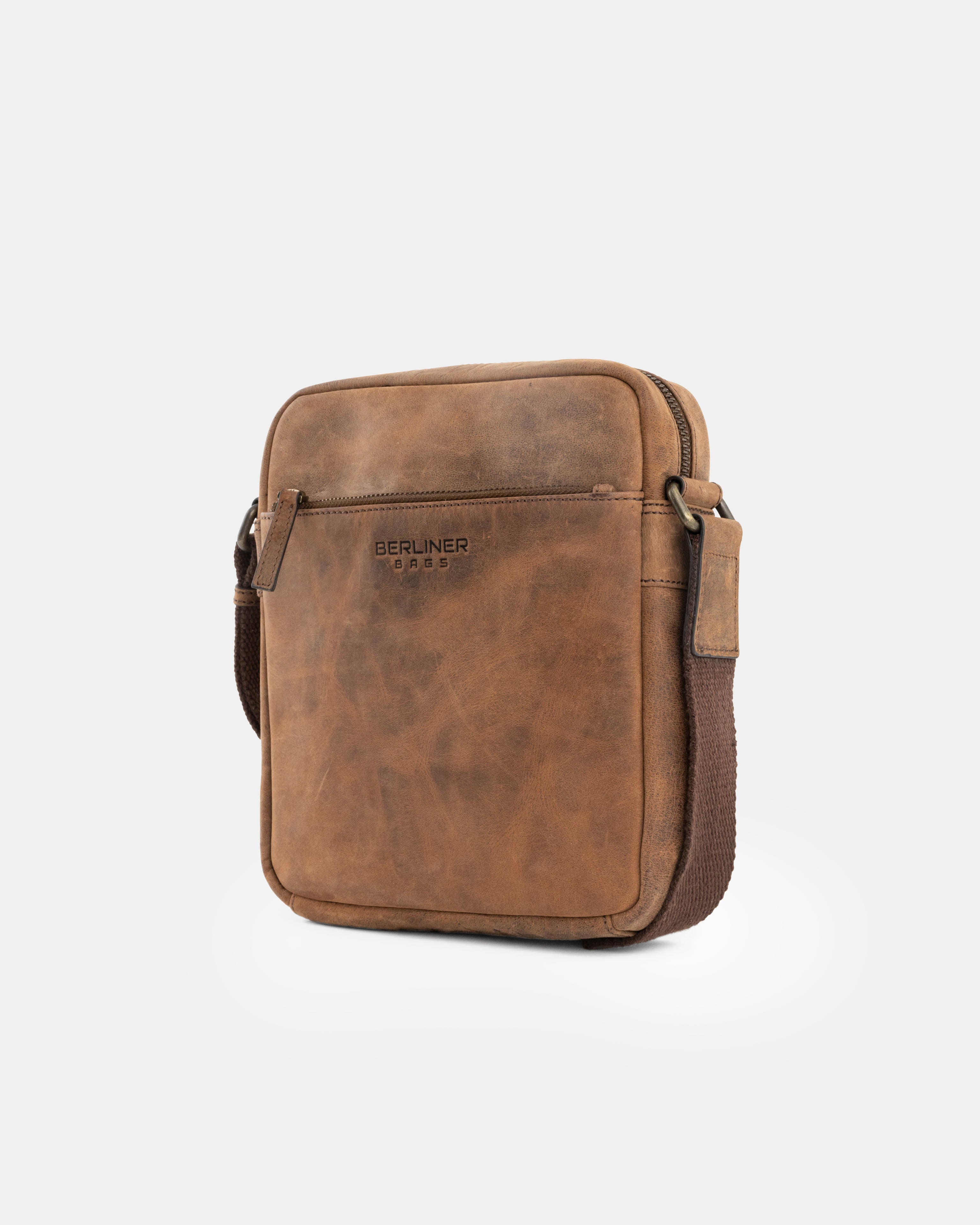 Angled view of earth leather messenger bag details