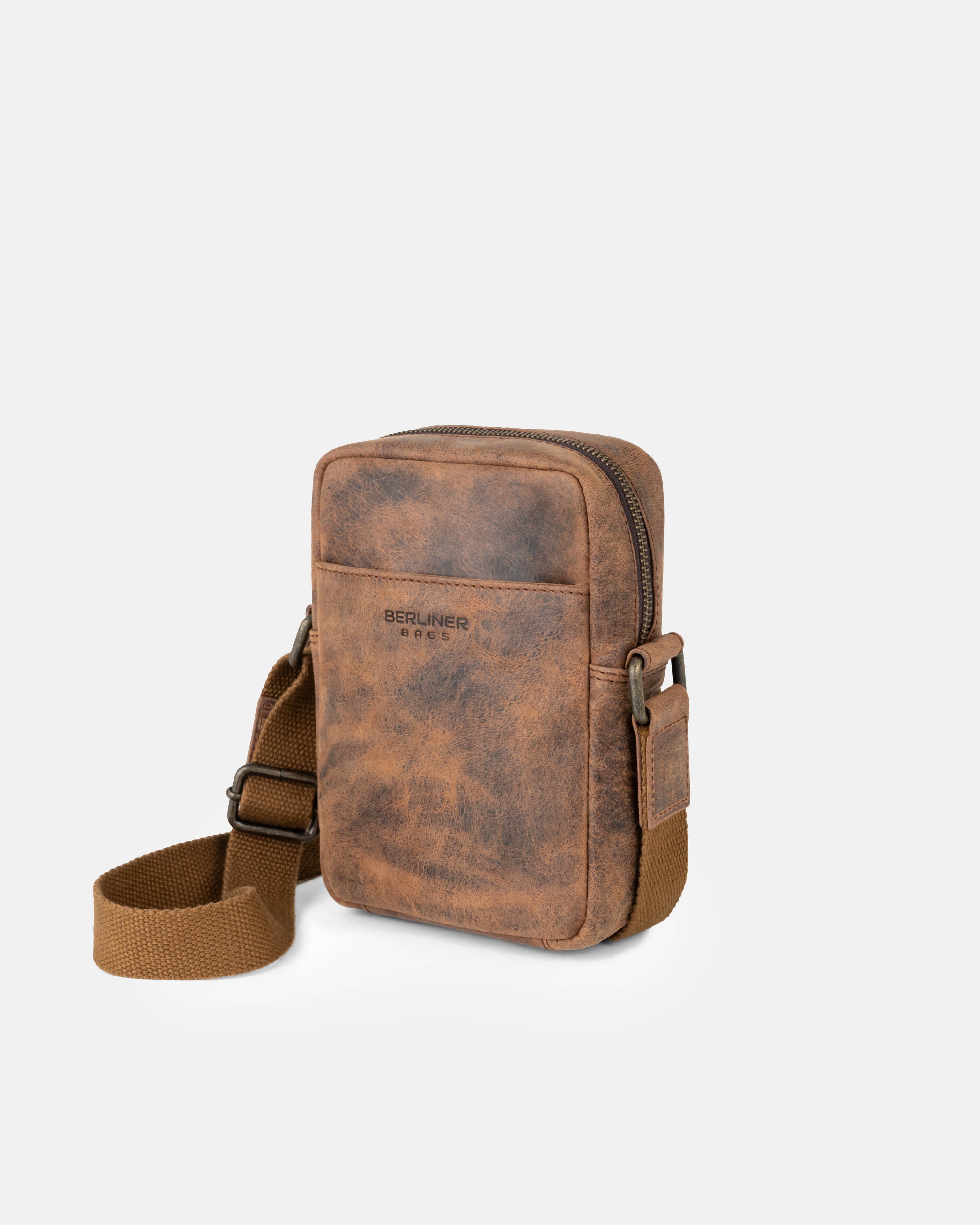 Angled front view of earth leather messenger bag with an adjustable strap