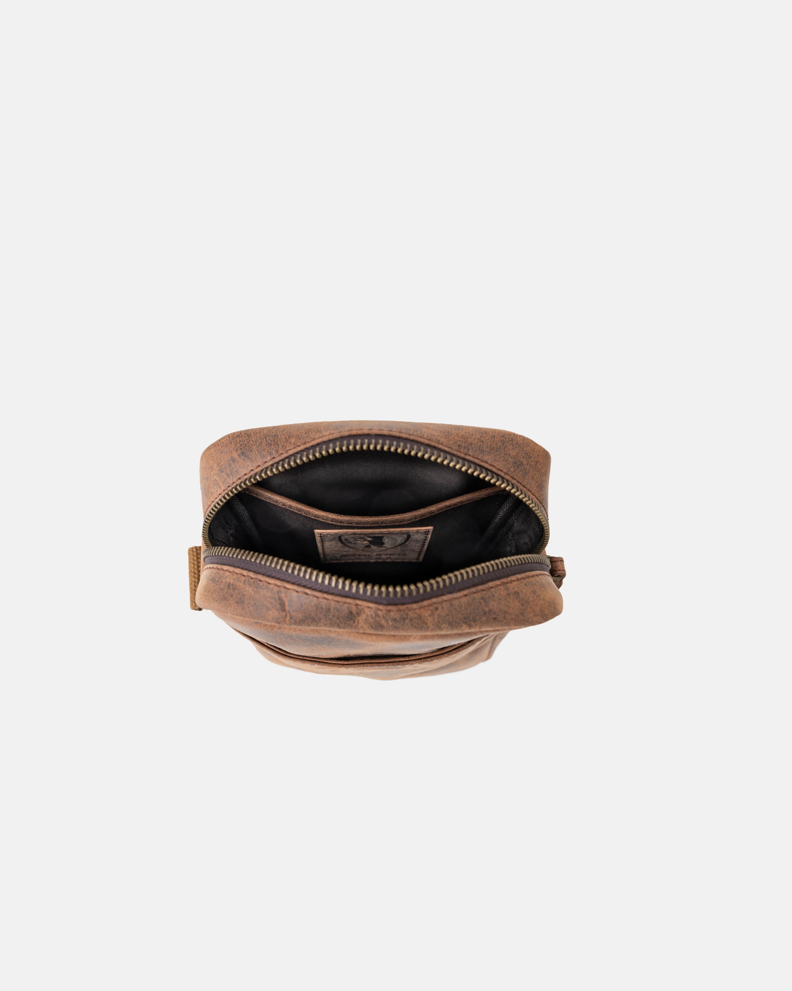 Top-down open view of earth leather messenger bag interior details