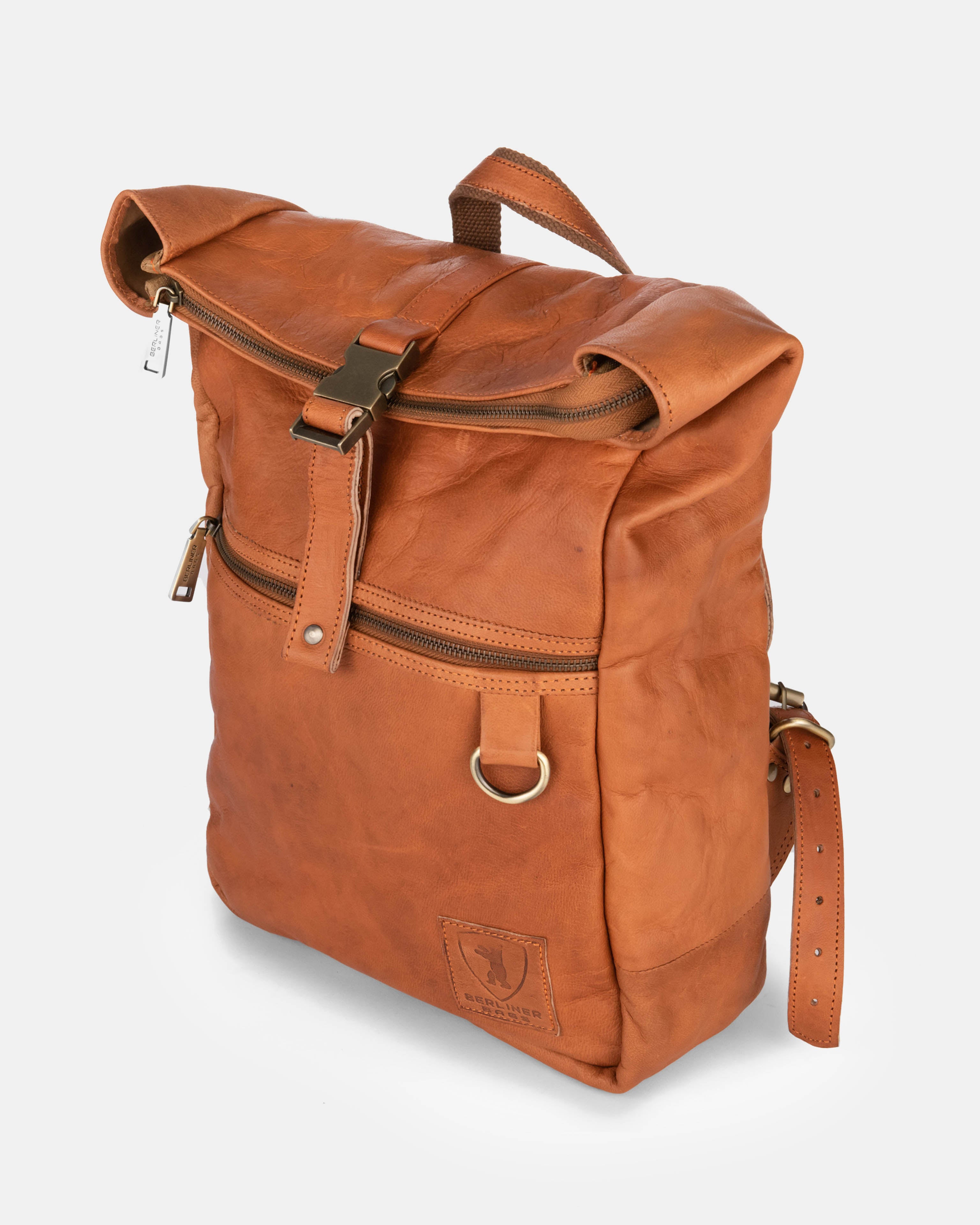 Side view of a vintage leather backpack bag with zipper