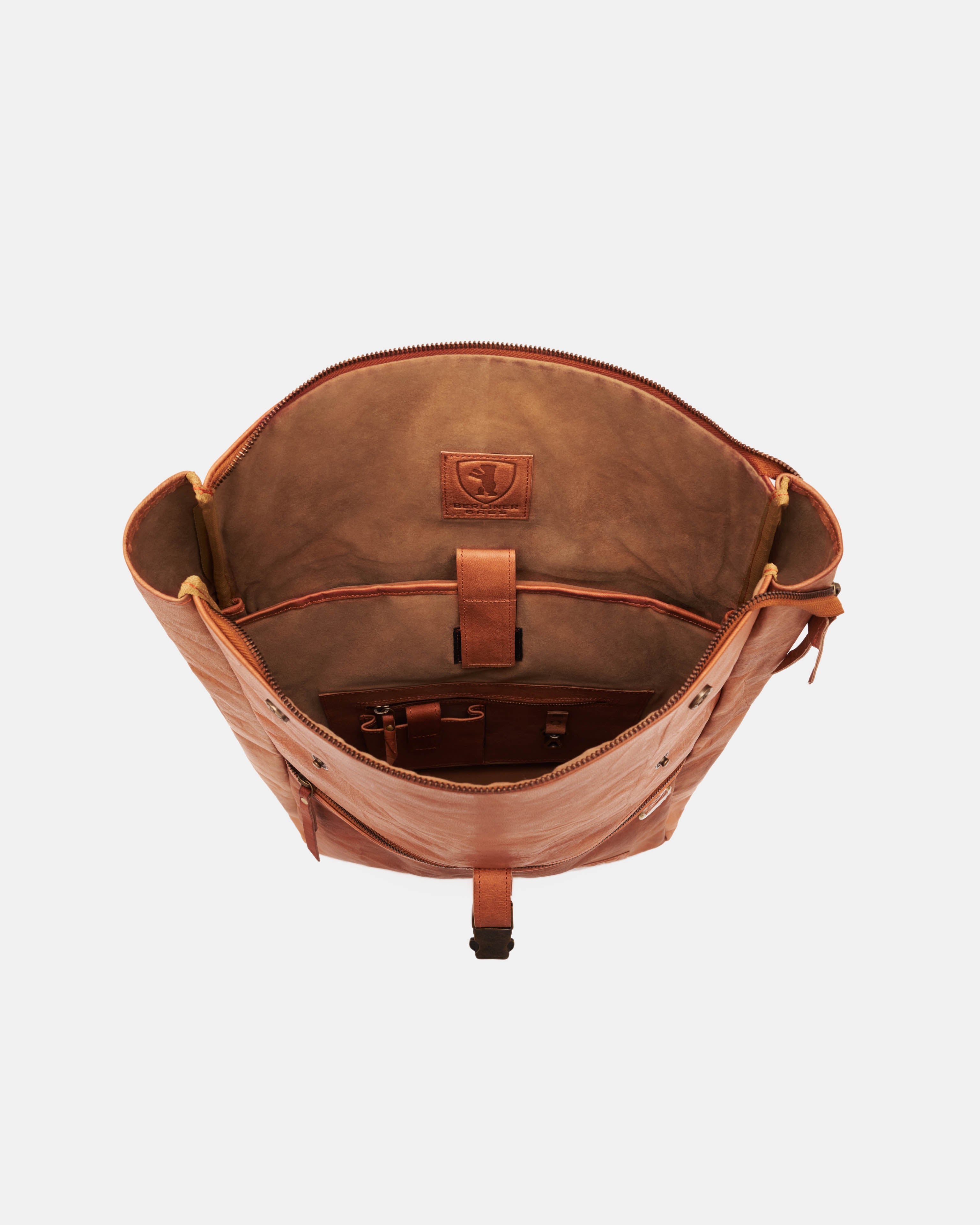 Top view showing inside of open vintage leather backpack bag