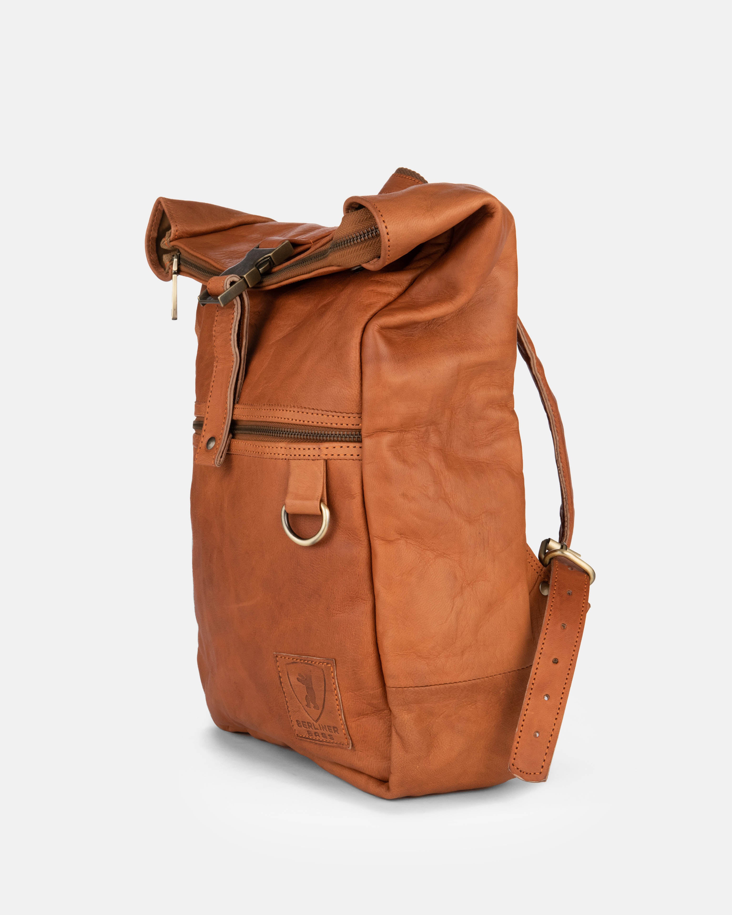 Side view of a vintage leather backpack bag with zipper