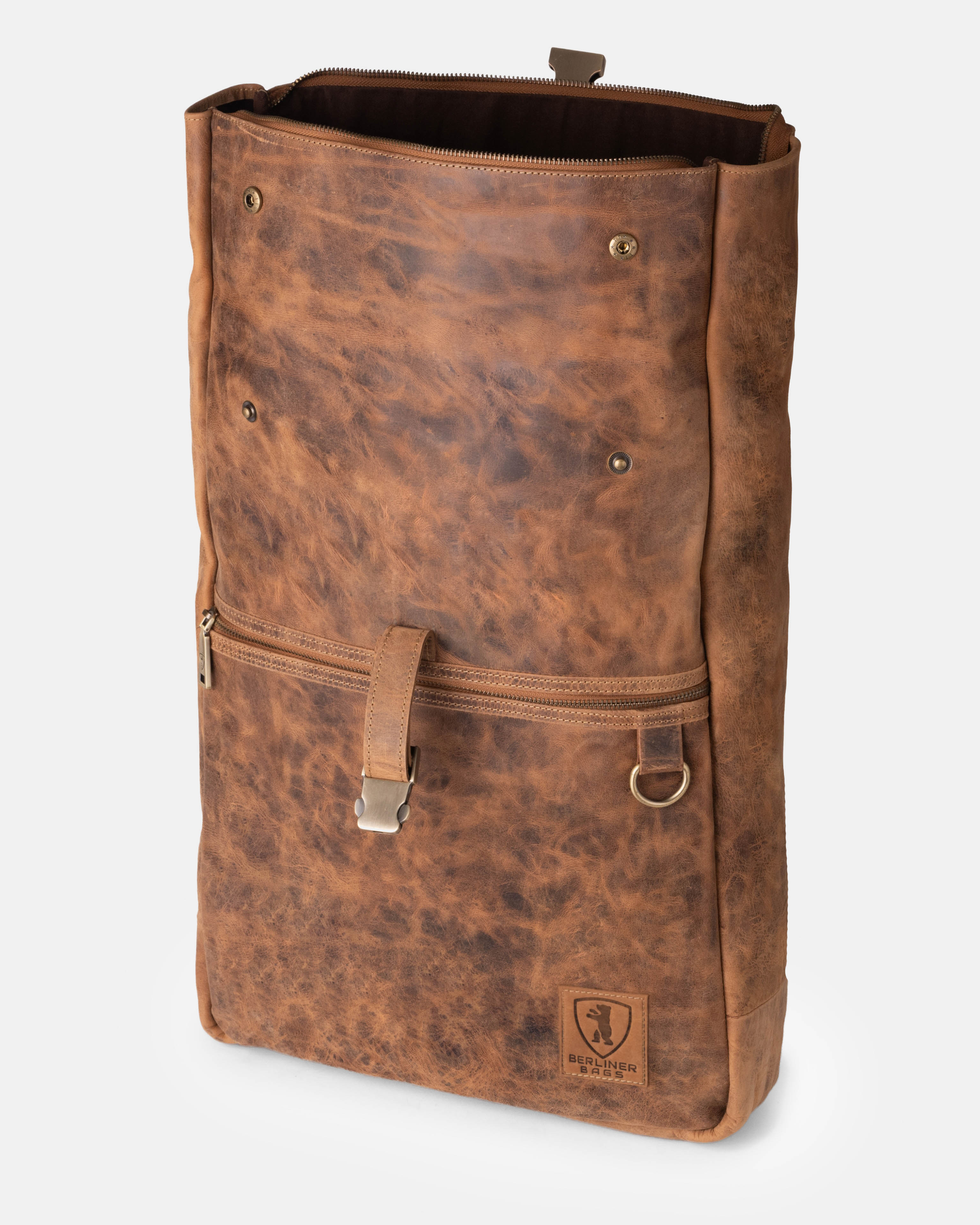 Side view of unrolled walnut leather backpack bag with snaps