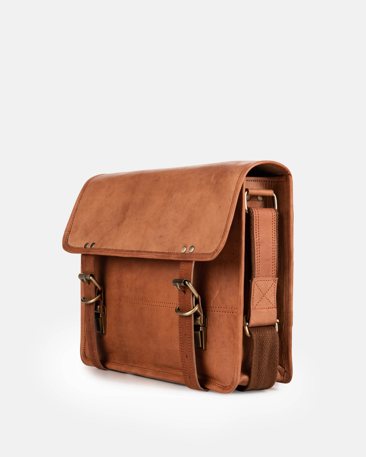Angled front-right view of a vintage leather briefcase or satchel messenger bag featuring double buckle closures and a fabric-lined leather shoulder strap attached to the side