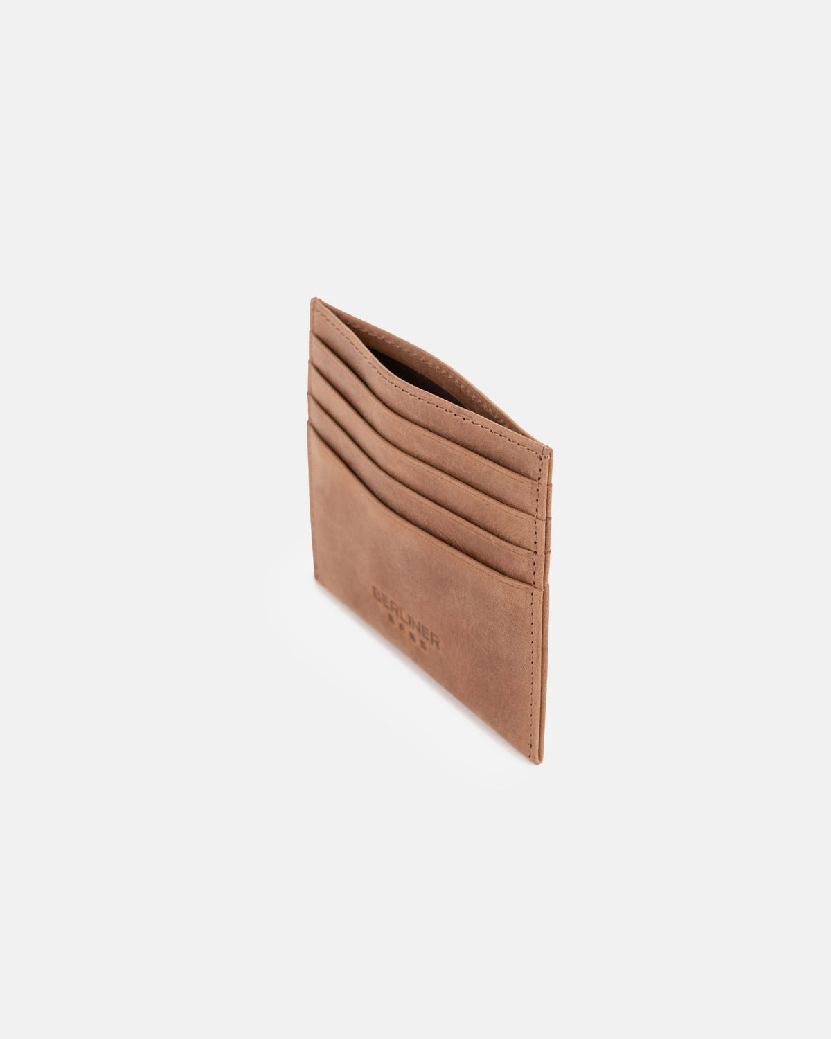 High-angle view of camel leather card case