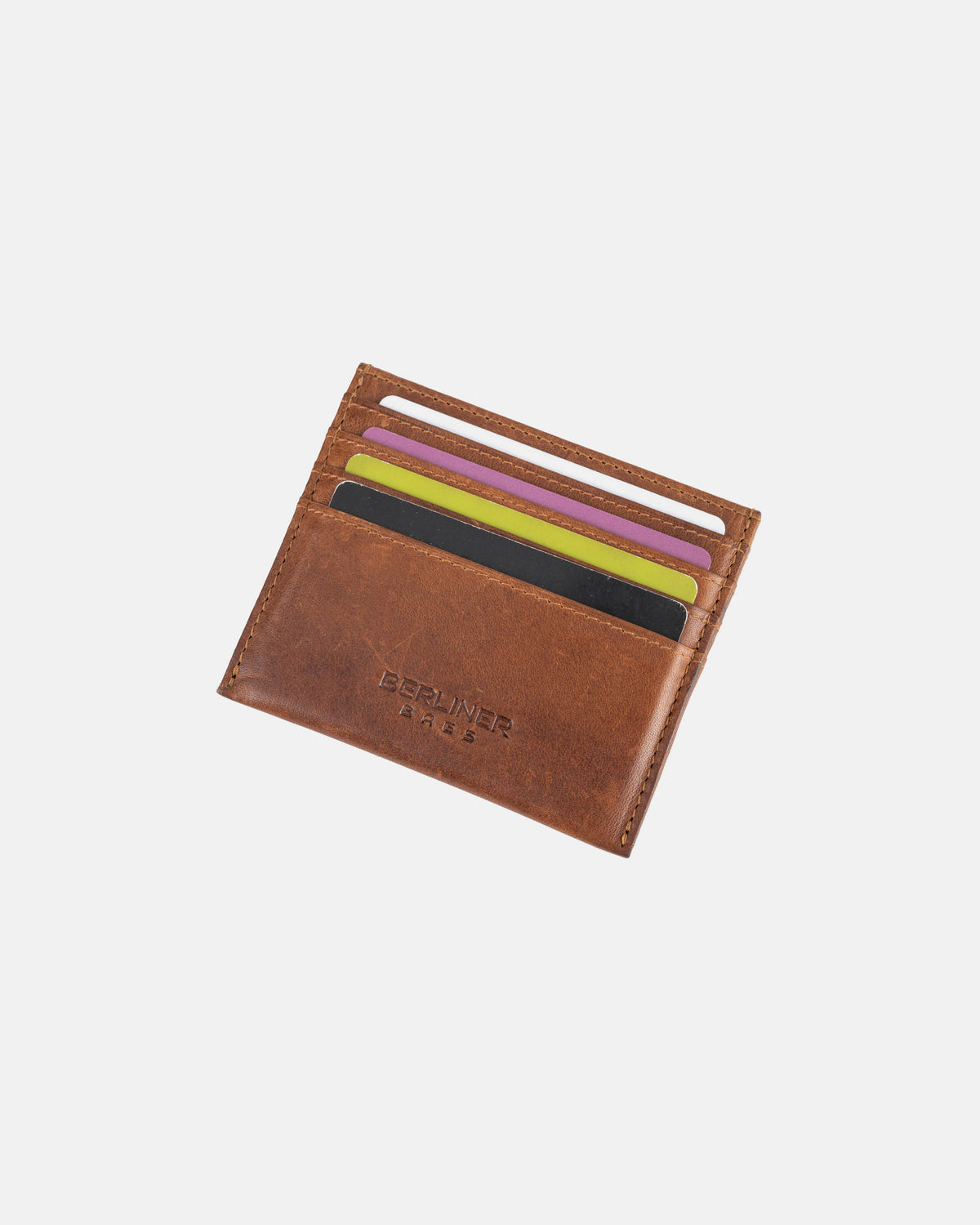 Front view of cognac leather card case all slot filled with cards