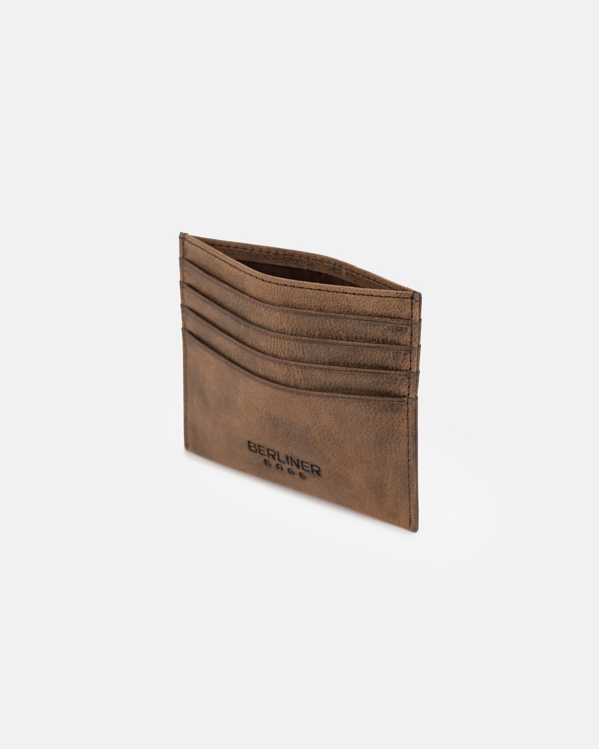 High-angle view of espresso leather card case
