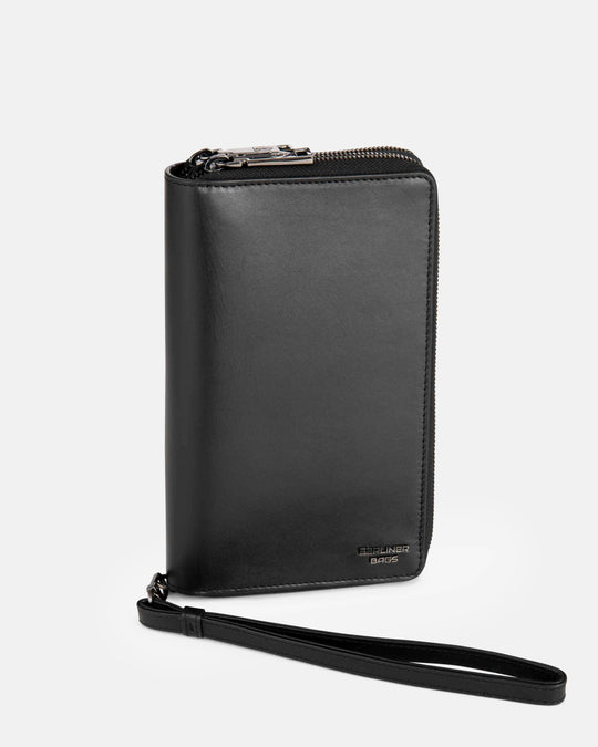 Side view of black leather  wallet with wristlet