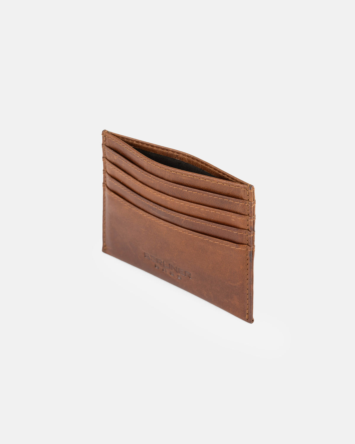 Side view of cognac leather card case