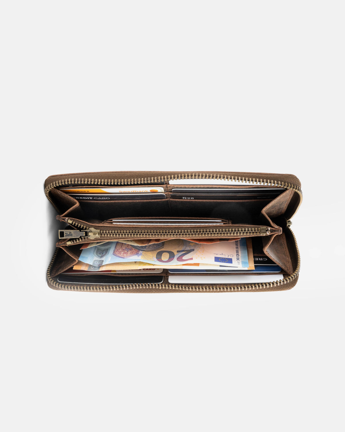 Top-down view of earth leather wallet showing inside cards and cash