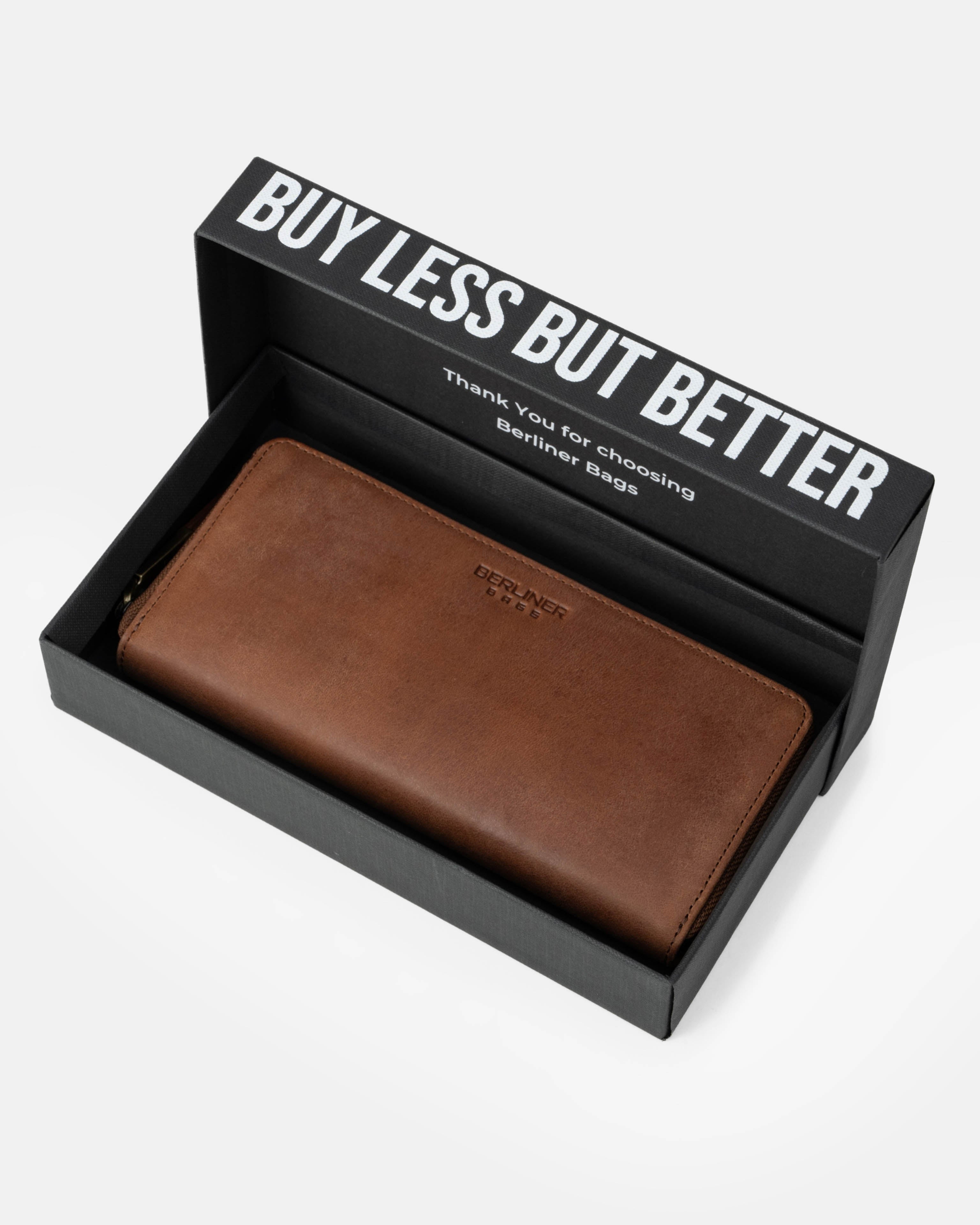 A camel leather wallet inside the branded box