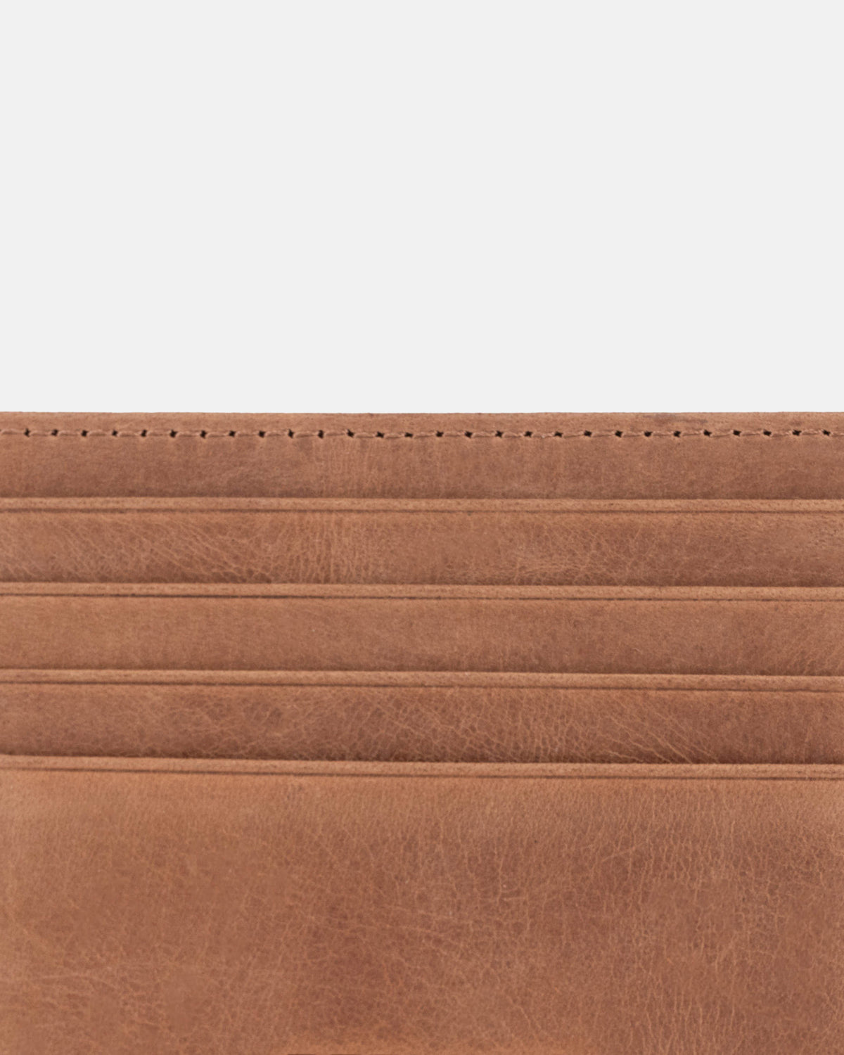 Close-up view of camel leather card case