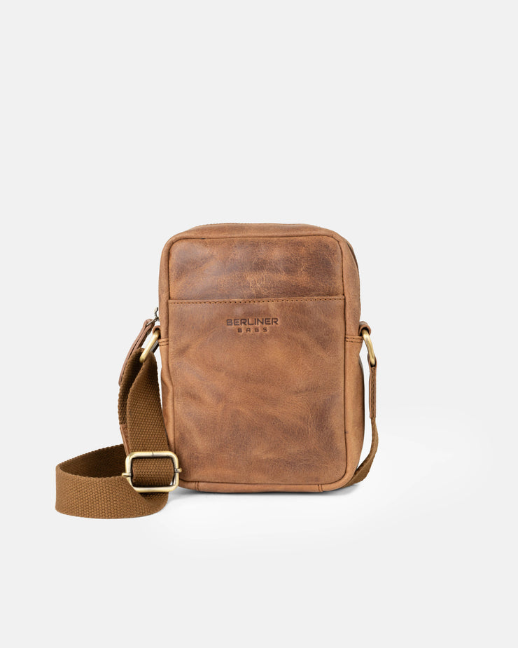 Front view of camel leather messenger bag with an adjustable strap