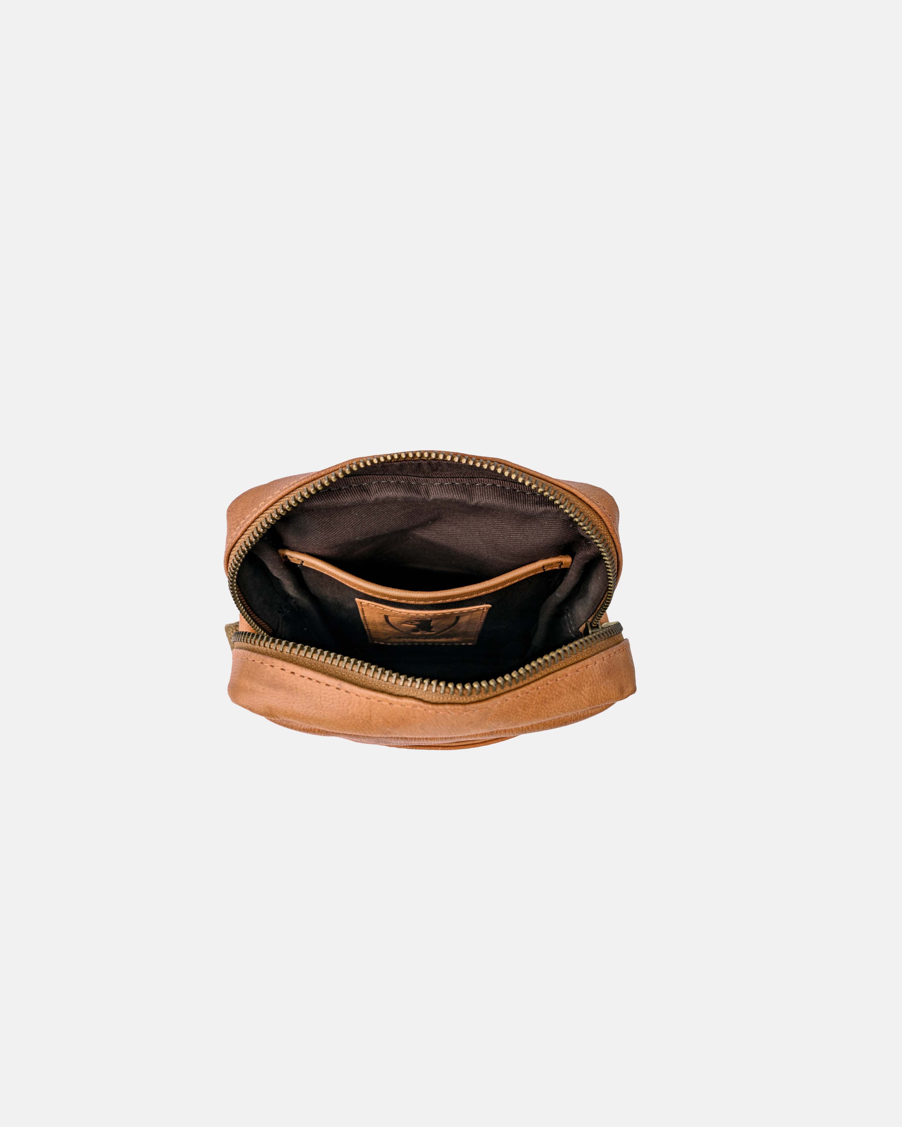 Top-down open view of vintage leather messenger bag interior details