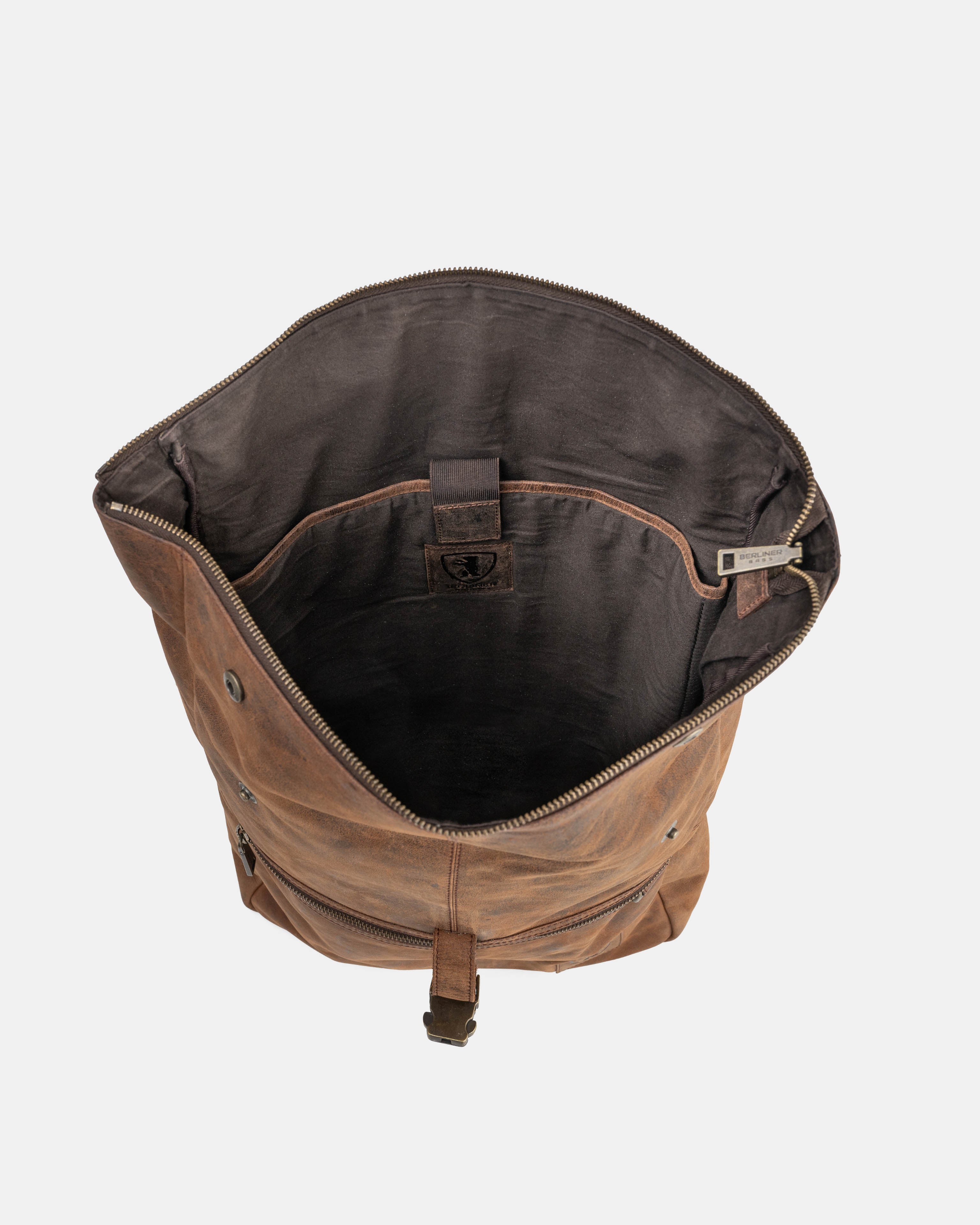 Top-down view looking into the interior of the earth leather backpack.