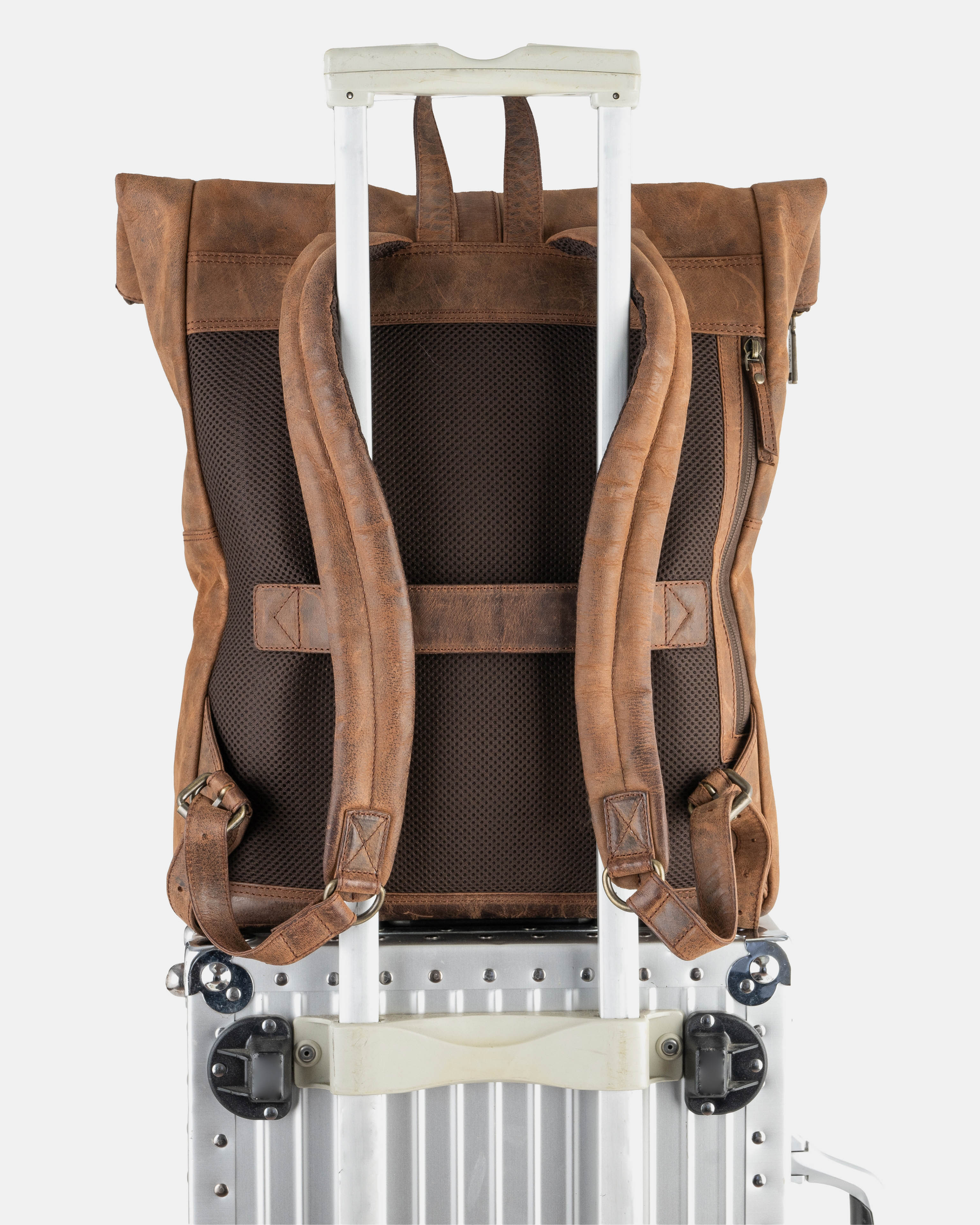  Earth leather backpack attached to the handle of rolling luggage