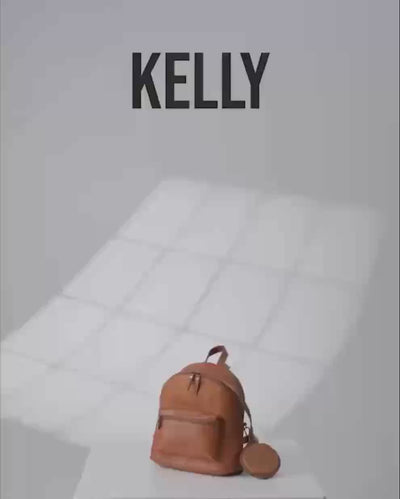 Product shot of a vintage leather zip-around backpack.