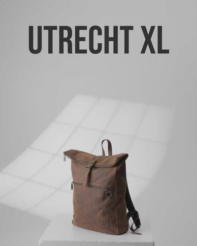 Product shot of Utrecht XL earth leather roll-top backpack.