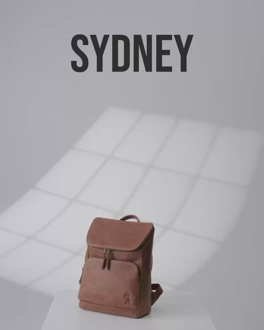 Studio shot of a camel leather zip-around backpack